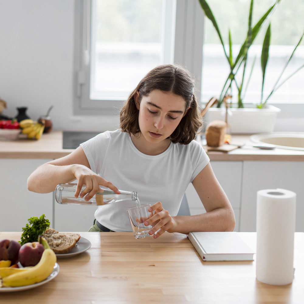 front-view-young-woman-relaxing-kitchen