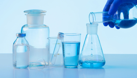 side-view-scientist-holding-flask.jpg