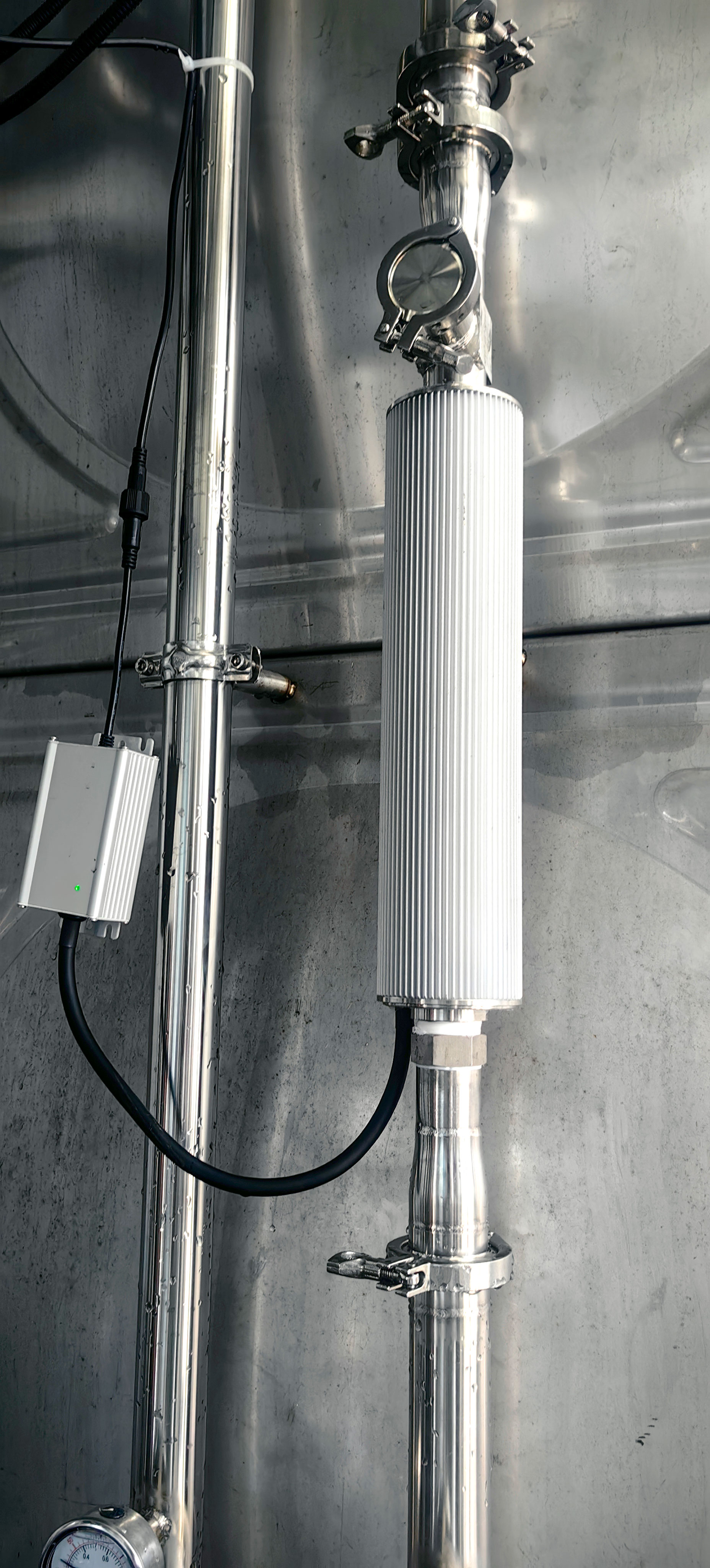 Compact inline UVC-LED disinfection unit on a 2-inch pipe.